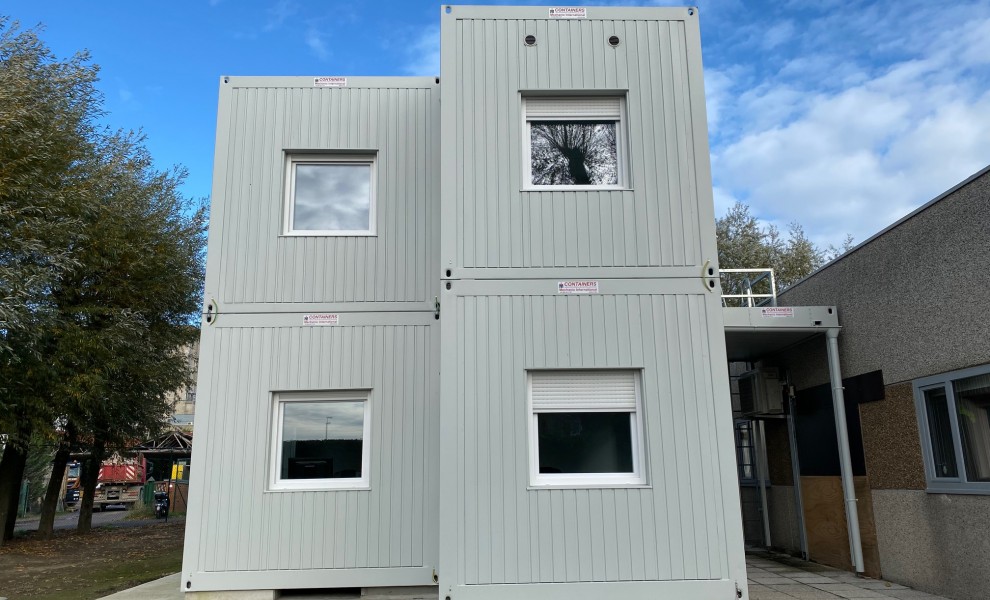 Modular container building in light grey